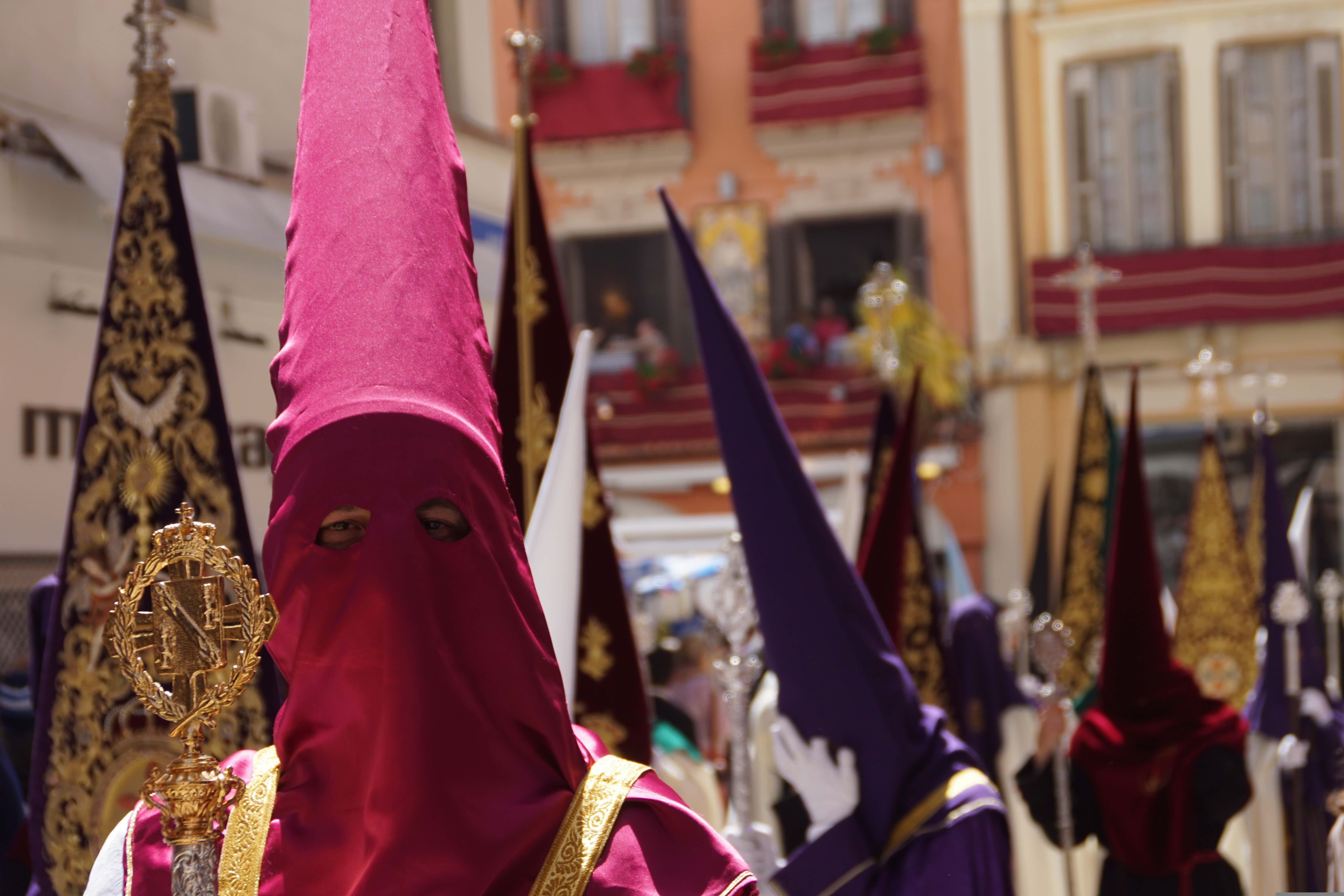 Nazarenos in traditional robes and capirotes during Holy Week in Spain