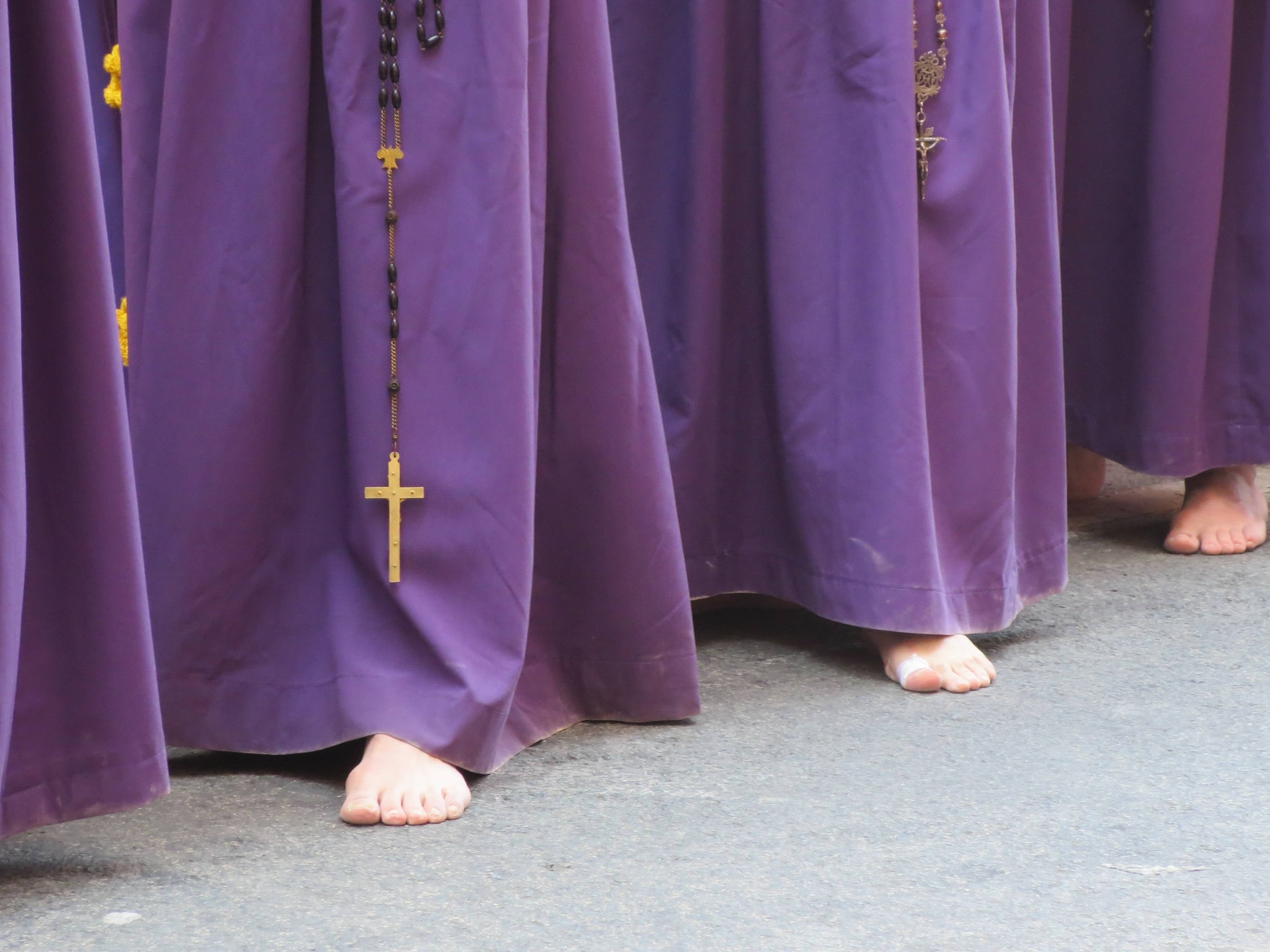 Crowds lining the streets to watch a Semana Santa procession in Spain